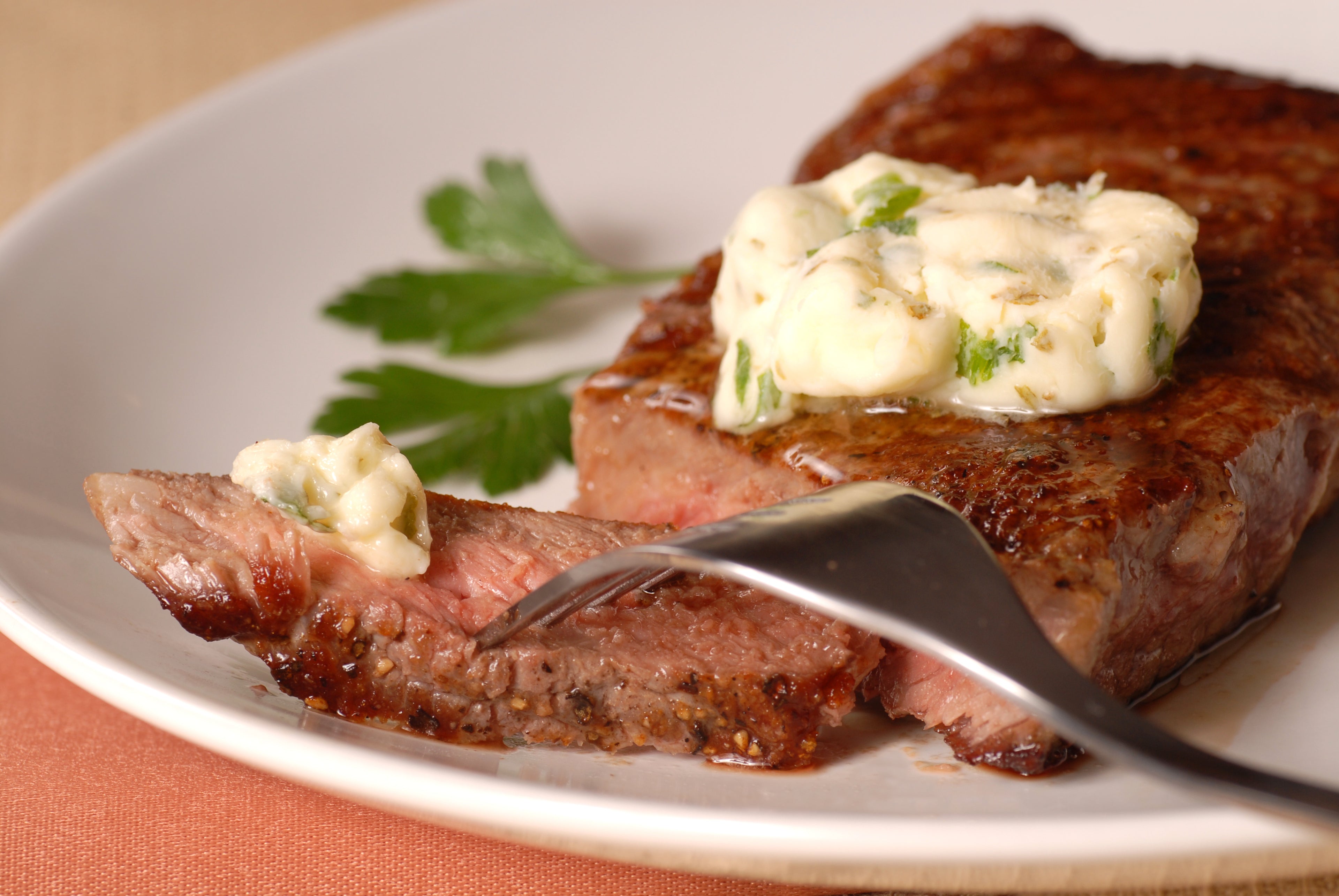 Deliciously cooked beef steak placed on a plate, looking juicy